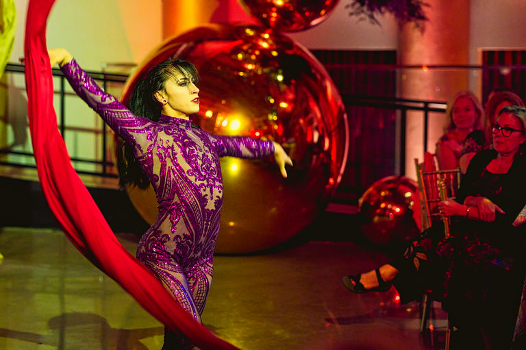 Golden Hour immersive milestone birthday celebration at Hollywood Theater Minneapolis with custom aerial performers and butterfly motif