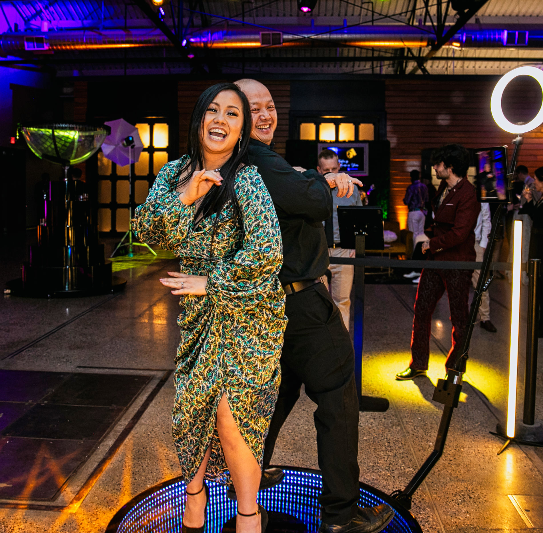 Liza Minnelli impersonator performing from a giant aerial moon in gold spotlight, Studio 54 disco revival entertainment